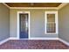 Front door entry with brick flooring and sidelights at 1072 Green St, Roswell, GA 30075