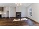 Bright living room features hardwood floors, a fireplace, and an open floor plan at 1072 Green St, Roswell, GA 30075