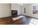 Bright living room with hardwood floors and a modern fireplace at 1072 Green St, Roswell, GA 30075