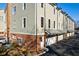 Exterior view of townhomes with attached garages at 1072 Green St, Roswell, GA 30075