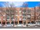 Brick building exterior with ample parking and street-level retail at 333 Nelson Sw St # 404, Atlanta, GA 30313