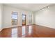 Bright living room with hardwood floors and access to balcony at 333 Nelson Sw St # 404, Atlanta, GA 30313