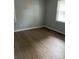 Simple bedroom with hardwood floors and neutral walls at 1228 Elizabeth Sw Ave, Atlanta, GA 30310