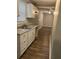 Kitchen with white cabinets and laminate countertops at 1228 Elizabeth Sw Ave, Atlanta, GA 30310