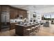 Open kitchen with large island, stainless steel appliances, and hardwood floors at 2726 Thornwilde Se Ln, Vinings, GA 30339
