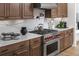Modern kitchen with stainless steel appliances and quartz countertops at 2726 Thornwilde Se Ln, Vinings, GA 30339