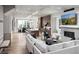 Open concept living area with hardwood floors, fireplace and large windows at 2726 Thornwilde Se Ln, Vinings, GA 30339