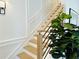 Oak staircase with black metal railing and white wall at 2726 Thornwilde Se Ln, Vinings, GA 30339