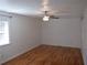 Spacious bedroom with hardwood floors and ceiling fan at 3952 Creel Dr, Lithia Springs, GA 30122