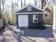 Detached shed with double doors and window, providing ample storage at 3952 Creel Dr, Lithia Springs, GA 30122