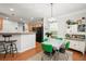 Bright dining area with retro table and chairs, adjacent to kitchen at 439 Mountain View Ln, Woodstock, GA 30188