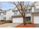 Two-story townhome with a brick facade at 439 Mountain View Ln, Woodstock, GA 30188