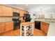 Modern kitchen with stainless steel appliances and wood cabinetry at 439 Mountain View Ln, Woodstock, GA 30188
