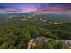 Night aerial view of home with city lights in the distance at 101 Barker Rd, Cumming, GA 30040