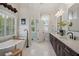 Elegant bathroom with double vanity, soaking tub, and separate shower at 101 Barker Rd, Cumming, GA 30040