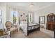 Charming bedroom with a four-poster bed and ample space at 101 Barker Rd, Cumming, GA 30040