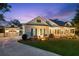 Stunning home with attached garage at twilight at 101 Barker Rd, Cumming, GA 30040