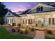 Charming home with a welcoming front porch at dusk at 101 Barker Rd, Cumming, GA 30040