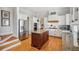 Modern kitchen with stainless steel appliances and hardwood floors at 101 Barker Rd, Cumming, GA 30040