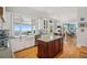 Bright kitchen with white cabinets, granite countertops, and island, overlooking stunning mountain view at 101 Barker Rd, Cumming, GA 30040