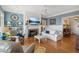 Cozy living room with fireplace, hardwood floors, and built-in shelving at 101 Barker Rd, Cumming, GA 30040