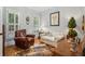 Cozy sitting room featuring a leather armchair and a comfortable sofa at 101 Barker Rd, Cumming, GA 30040