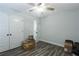 Bedroom with double doors and ceiling fan at 25 Water Oak Trl, Covington, GA 30014