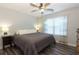 King-size bed in bright bedroom with wood floors at 25 Water Oak Trl, Covington, GA 30014