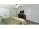 Large bedroom with king bed, TV, and plenty of closet space at 25 Water Oak Trl, Covington, GA 30014