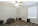 Simple bedroom with ceiling fan and wood floors at 25 Water Oak Trl, Covington, GA 30014