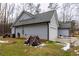 Side view of a gray house with white garage door at 25 Water Oak Trl, Covington, GA 30014