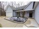 Front view of a gray house with a black front door and landscaping at 25 Water Oak Trl, Covington, GA 30014