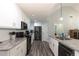 Modern kitchen with white cabinets and granite countertops at 25 Water Oak Trl, Covington, GA 30014