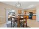 Eat-in kitchen with light wood cabinets and black appliances at 1246 Adcox Sq, Stone Mountain, GA 30088