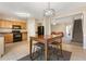 Kitchen with dining area, view into living room and stairs at 1246 Adcox Sq, Stone Mountain, GA 30088