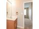 Clean bathroom with wood vanity and a large mirror at 2852 Vining Ridge Ter, Decatur, GA 30034