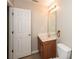 Simple bathroom with wood vanity and neutral decor at 2852 Vining Ridge Ter, Decatur, GA 30034