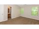 Spacious bedroom with two windows and neutral decor at 2852 Vining Ridge Ter, Decatur, GA 30034