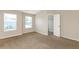 Well-lit bedroom featuring neutral walls and carpet at 2852 Vining Ridge Ter, Decatur, GA 30034
