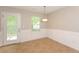 Dining area with tile floor, white wainscoting, and sliding glass doors at 2852 Vining Ridge Ter, Decatur, GA 30034