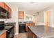 Modern kitchen features black appliances and granite countertops at 2852 Vining Ridge Ter, Decatur, GA 30034