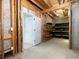 Unfinished basement showing room for storage with shelves and tubs at 342 Holbrook Rd, Smyrna, GA 30082