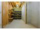 Unfinished basement with insulated walls and shelves for storage at 342 Holbrook Rd, Smyrna, GA 30082