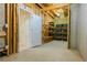 Unfinished basement with storage and shelving at 342 Holbrook Rd, Smyrna, GA 30082