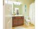 Bathroom with dark wood vanity, framed mirror, and shower with curtain at 342 Holbrook Rd, Smyrna, GA 30082