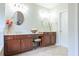 Bathroom featuring dual vanity sinks with wooden cabinets at 342 Holbrook Rd, Smyrna, GA 30082