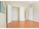 Bedroom with hardwood floors, large closet, and access to hallway at 342 Holbrook Rd, Smyrna, GA 30082