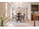 Cozy dining room featuring neutral walls, stylish chandelier, and elegant table setting at 342 Holbrook Rd, Smyrna, GA 30082