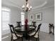 Elegant dining room with neutral walls, chandelier, and traditional wood table at 342 Holbrook Rd, Smyrna, GA 30082