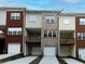 Townhome exterior showcasing attached garages and private balconies with various exterior finishes at 342 Holbrook Rd, Smyrna, GA 30082